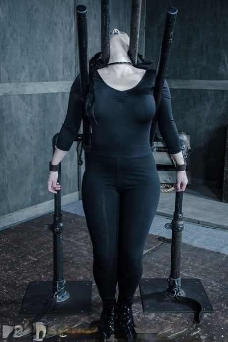 Thick sex slave Luna Lavey finds herself completely restrained in a dungeon