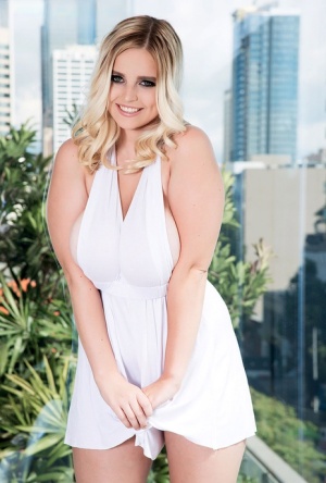 Dirty blonde plumper Codi Vore whips out her huge boobs against city skyline