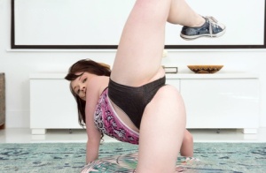 Amateur model Athena Rayne displays her flexibility in booty shorts