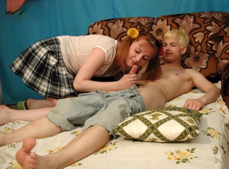 Young looking girl and her boyfriend engage in bareback sex on a sofa