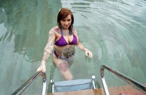 Tattooed redhead Monte Luxe doffs her bikini prior to anal dildoing