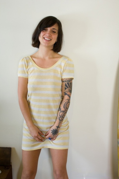 Tattooed chick Liandra Dahl showcases her trimmed bush after getting naked