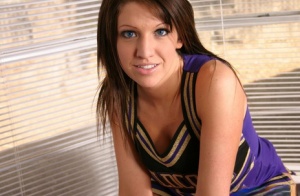 Watch as a slutty cheerleader strips out of her uniform showing off her huge