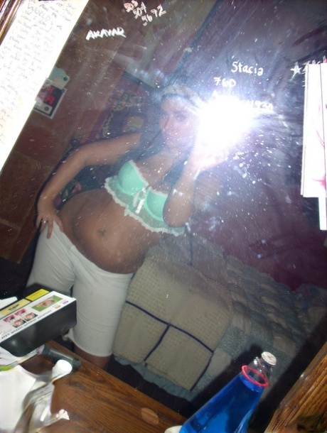 Horny teen takes self pictures of her perky tits in a lace bra