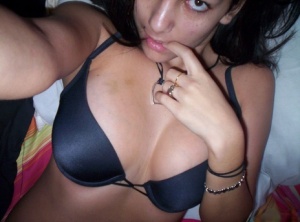 Nikki takes pictures of herself in a black tiny bra which her tits are almost