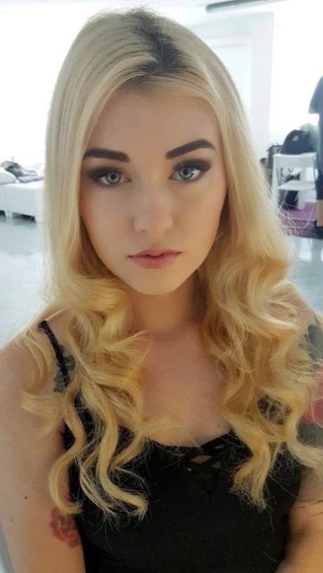 Beautiful blonde slut Misha Cross takes a selfie fully clothed and stark naked