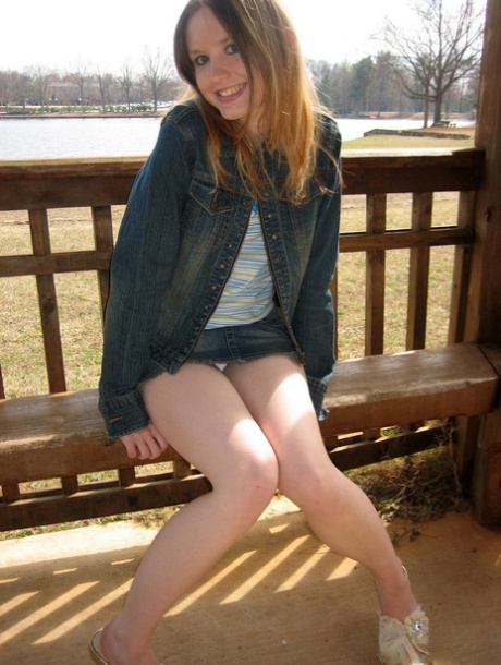 Cute slutty teen Shelby flashes her hard nipples at the lake in a public park