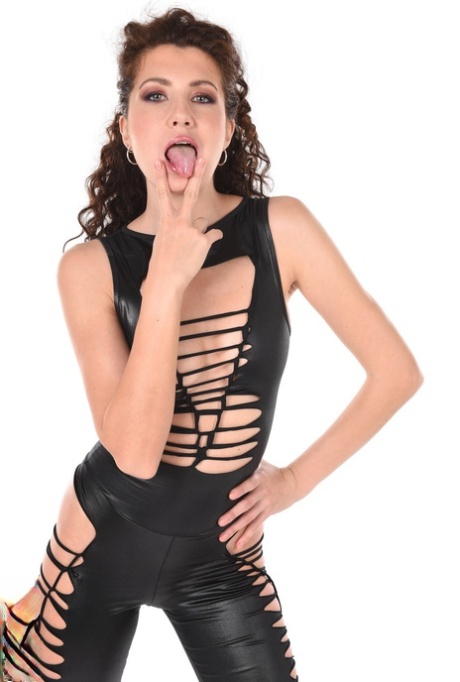 Sexy girl Gia Ren sports wavy hair while removing revealing leather clothing