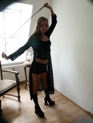 Sexy blonde Sweet Kathy wields a whip while clothed in black boots