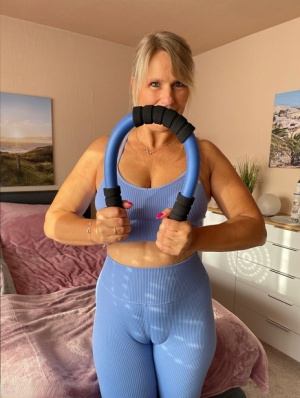 Fit middle-aged woman sports a camel toe before showing her tits and pussy