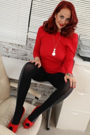 Kara Carter from Only Opaques in a tight red minidress with high heels and