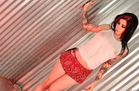 Wet chick Joanna Angel fingers her landing strip pussy in see thru tank top