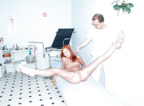 Nice looking redhead fetish milf gets fingered at the gyno cabinet