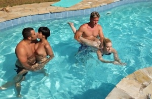 Coco Demal and her friend Nesty swimming with a handsome fellow