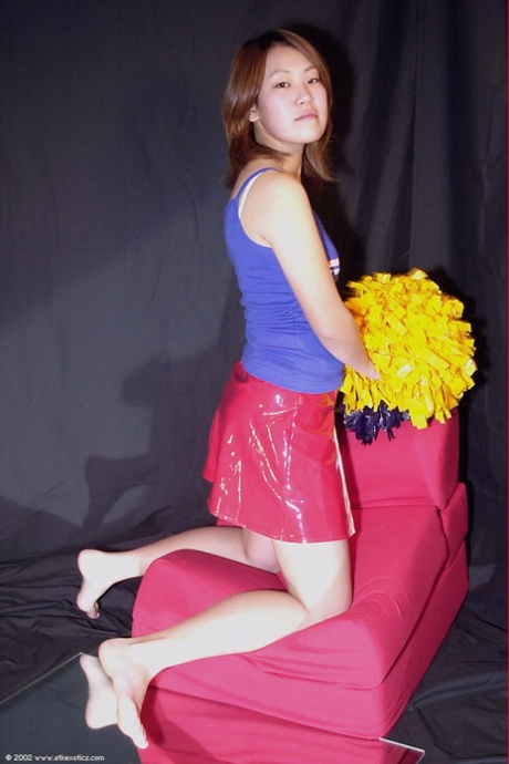 Amateur Japanese cheerleader Naoko loosing bare ass from panties and skirt