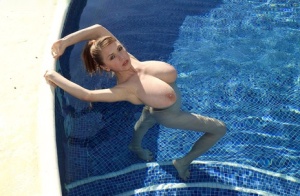 Hot MILF Merilyn Sakova exposes her huge boobs as she undresses for pool time