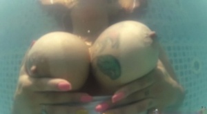 Hot Latina chick Cristine Castellari pools her big boobs out in swimming pool