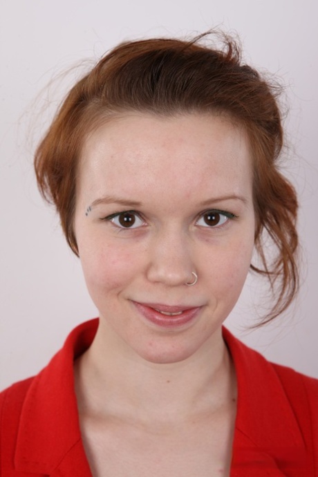 Natural redhead Klara gets completely naked before a close-up of her pussy 13079223