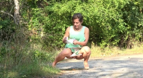 White chick pulls down her panties and squats for a piss on a country path 53842861