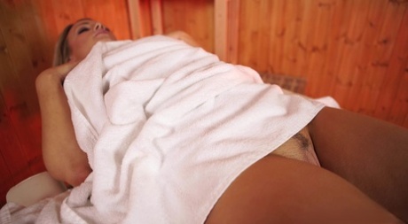 Blonde lady Penny L loses her thong while awaiting her massage attendant 71395192
