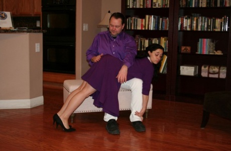 Dark haired girl Mackenzie Reed has her ass turned red during an OTK spanking 78915495