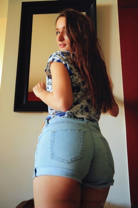 Slender brunette Elina shed shorts to spread ass and give pussy closeup
