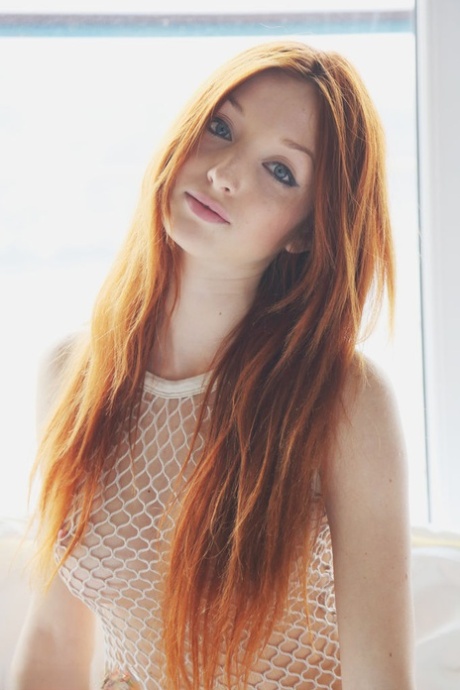 Natural redhead Micca gets naked in a sexy manner before working her tight ass 98074748