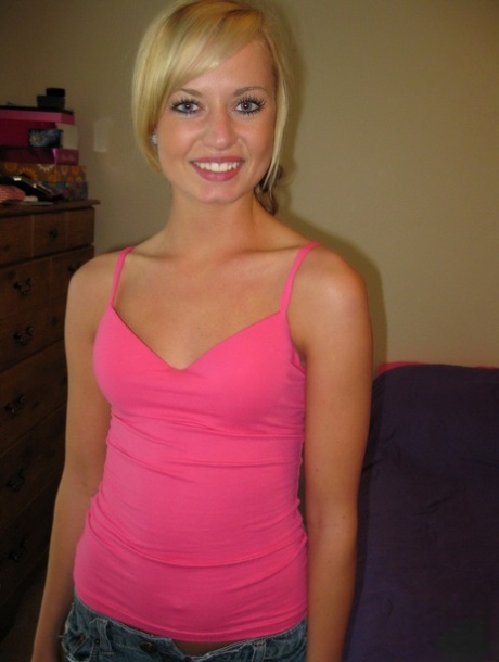 Petite blonde Codie Sweets uncovers her tiny tits as she strips naked on a bed 38925485