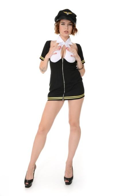 Leggy girl Marina Visconti frees big naturals from pilot uniform as she strips 11309049