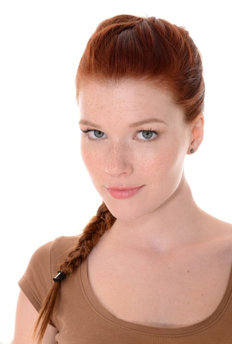 Sexy redhead Mia Sollis does a slow striptease before crossing her long legs 83064787