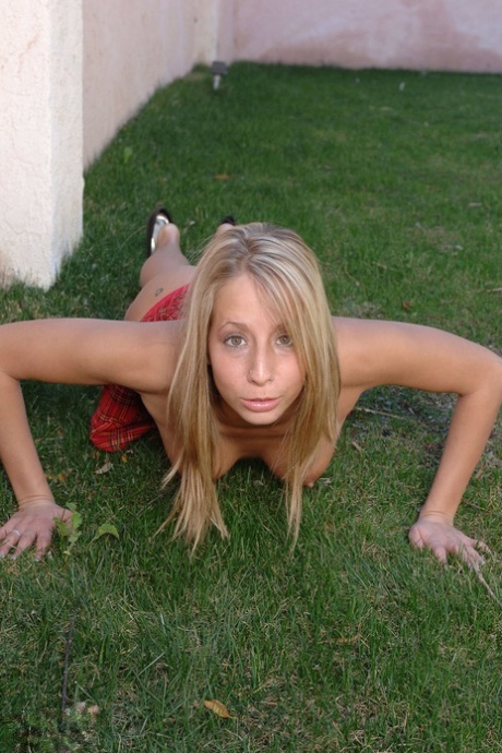Blonde amateur Ashley Jenson shows her tits and twat in a backyard 71111619