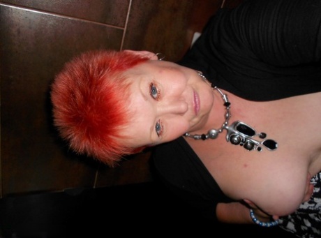 Sexy redhead mature bares her big floppy tits & takes a wet bald pussy selfie 56306415