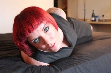 Redheaded chick is left on a bed while cleave gagged and rope bound 33693703