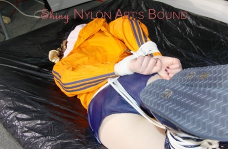 White girl is left tied up and gagged in a coat and nylon gym shorts 67675459