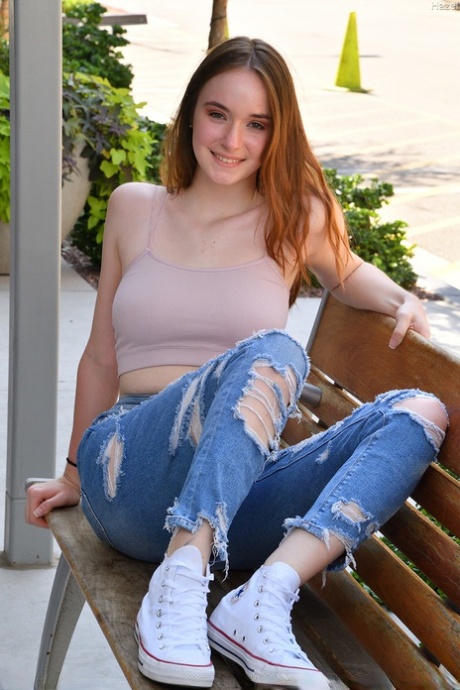 Natural redhead Hazel stands naked on a veranda before toying her pink pussy 42114357