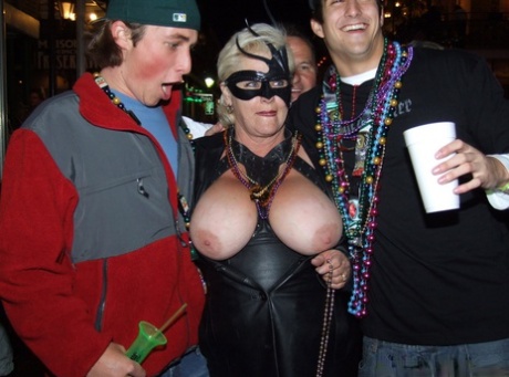 Inebriated girls expose their breasts during an outdoor gathering 37863981