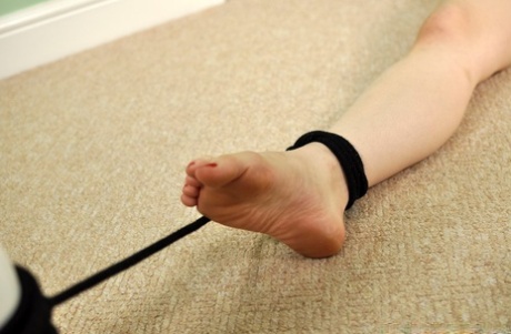 Naked white girl Lucia Love struggles against a ball gag while tied up 53797317