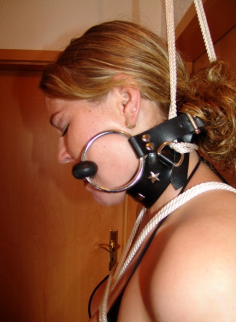 Natural redhead Justine is gagged with a horse bit while restrained 27266029