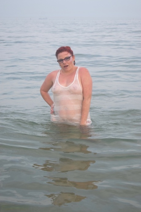 Tattooed redhead wades into the ocean before exposing herself 67330580