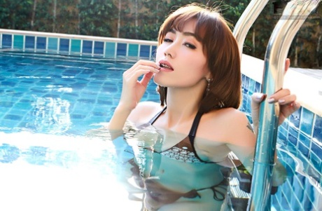 Asian beauty Yuri fondles her big natural tits while in a swimming pool 76466814