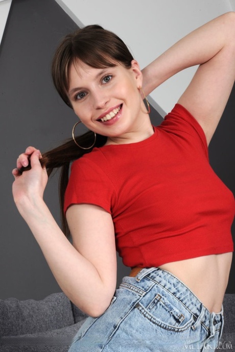 Sweet teen Aristeia removes a denim miniskirt to model completely naked 67992995