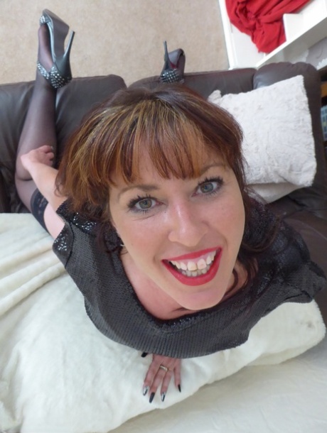 Older UK redhead Juicey Janey unleashes her great tits during solo action 27945745