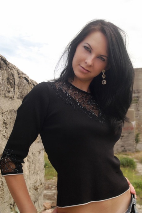 Hot brunette teen Katrin E gets totally naked in the undergrowth 41451134