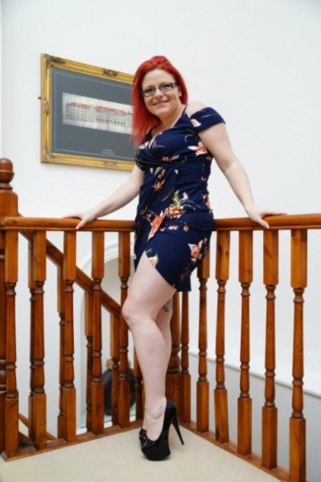 Tattooed redhead Mollie Foxxx shows her tits while changing into lingerie 51756992