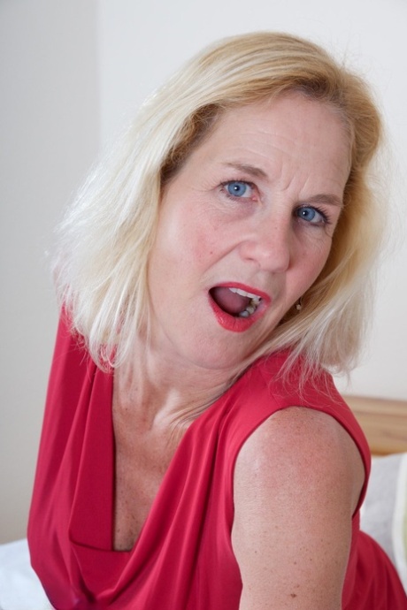 Middle-aged UK lady Molly Maracas strips to her lingerie in garters and nylons 98152021