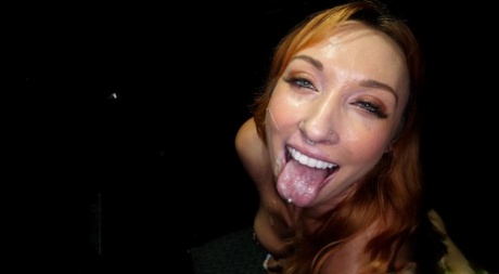 Redheaded chick Daisie Belle sucks the cum from cocks at a gloryhole 83190171