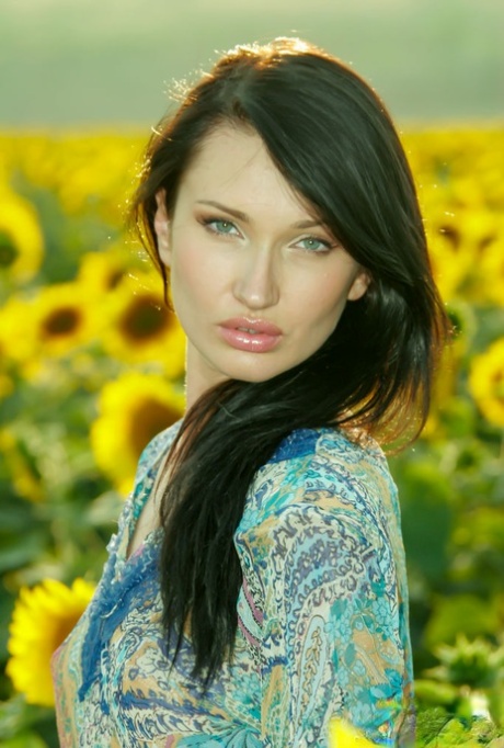 Stunningly beautiful 18-year-old Izolda M gets naked in a field of sunflowers 13104584