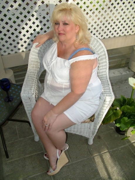 Overweight blonde Taffy Spanx gets naked on a patio before masturbating 88251991