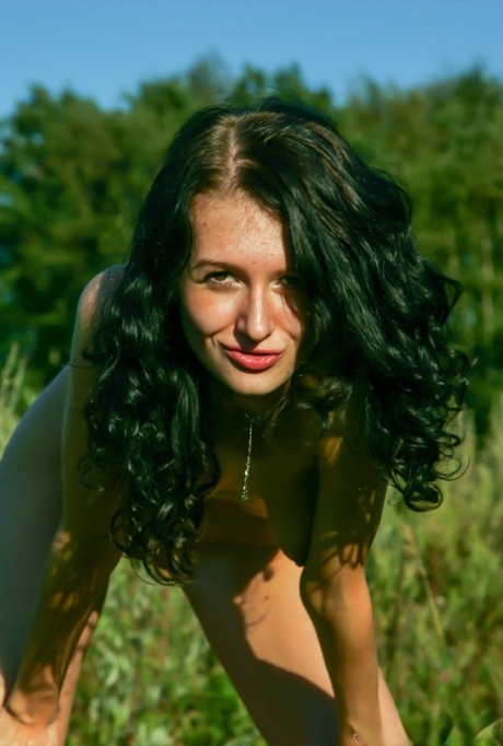 Beautiful brunette teen Voleta F gets totally naked in the countryside 51389562
