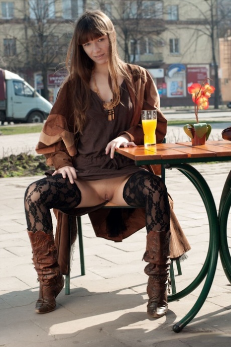 Nice teen Red Eva flashes her tits and pussy while in a public square 53773349